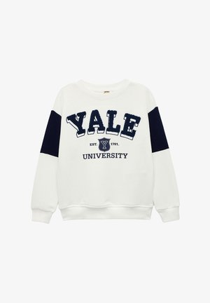 Biała bluza z nadrukiem w granatowe akcenty, z wypukłym napisem "YALE" i "UNIWERSYTET", okrągły dekolt i żeberkowe mankiety. Miękka w dotyku.
