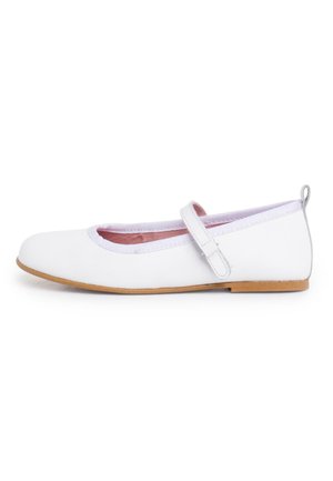 White flat shoe featuring a rounded toe, pink lining, a white strap across the instep, and a tan rubber sole. Smooth synthetic material.