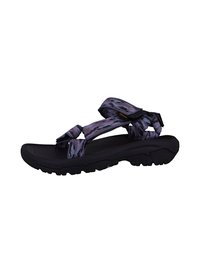 Sandale sportive noire avec des sangles à motifs violets et bleus, semelle rembourrée et semelle en caoutchouc texturée pour une meilleure adhérence.
