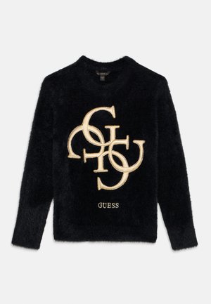 Pull en mohair noir avec un col rond, comportant un logo en fil d'or et le nom de la marque "GUESS" en bas. Texture douce, coupe décontractée.