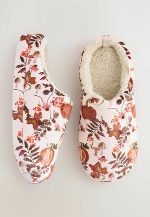 Floral print slippers in soft pink fabric feature a plush, beige fur lining and a round toe design, accented with leafy and pumpkin patterns.