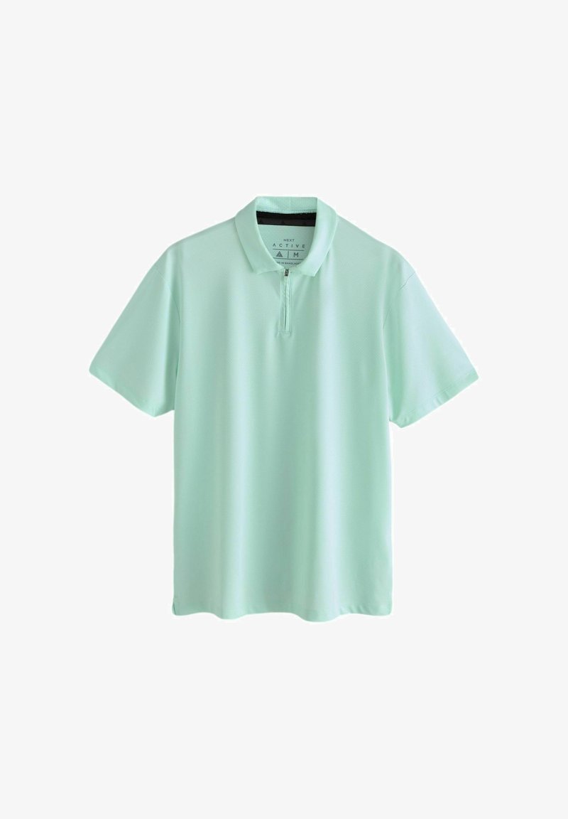 Hele roheline lühikeste varrukatega polosärk luku ja kraega, esitatud tavalise valge taustaga.