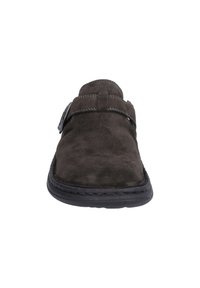 Dark gray suede slip-on shoe with a rounded toe, adjustable strap with metal hardware, and a black rubber sole. Textured surface visible.