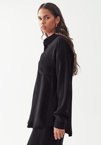 CALLI CUPRO - Camicia - black