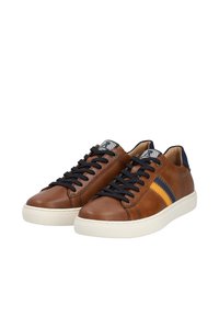 Brown leather sneakers with black laces, featuring a textured navy and yellow chevron stripe on the side, and a white rubber sole.