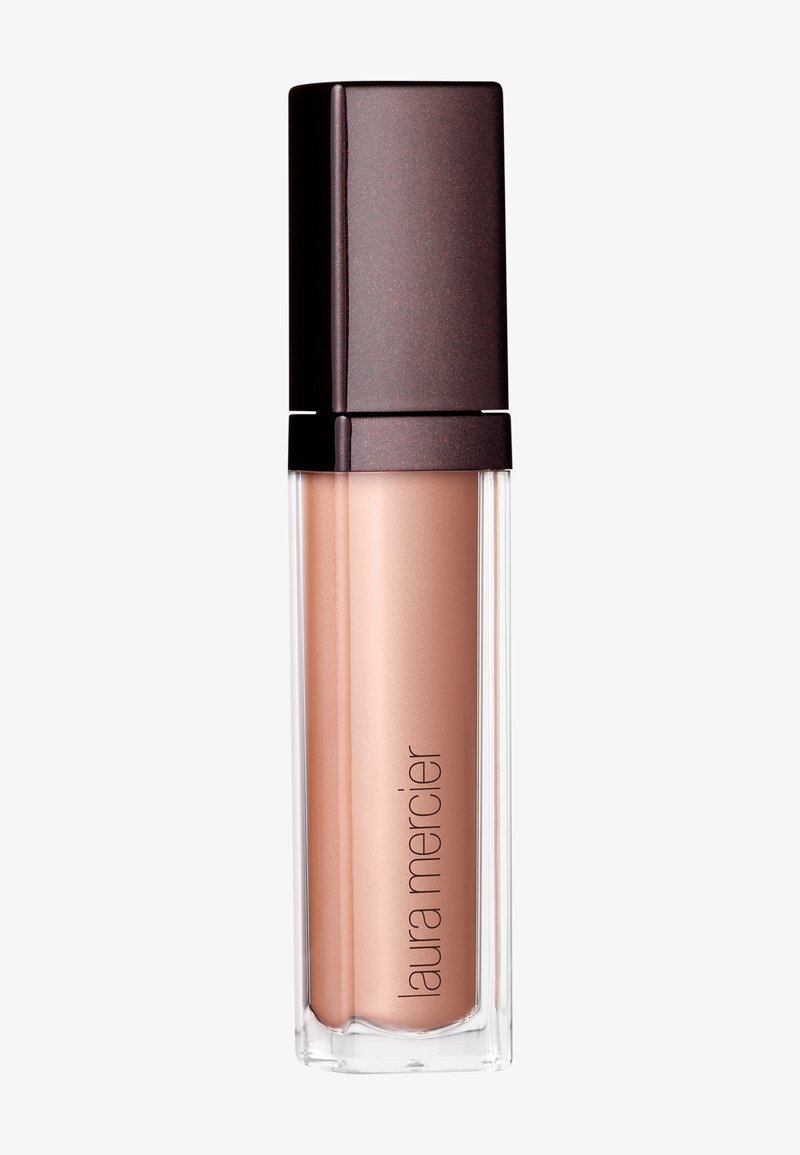 Gloss à lèvres dans un tube transparent avec une teinte bronze, dotée d'un capuchon carré marron foncé et d'une texture lisse. L'étiquette indique "Laura Mercier."