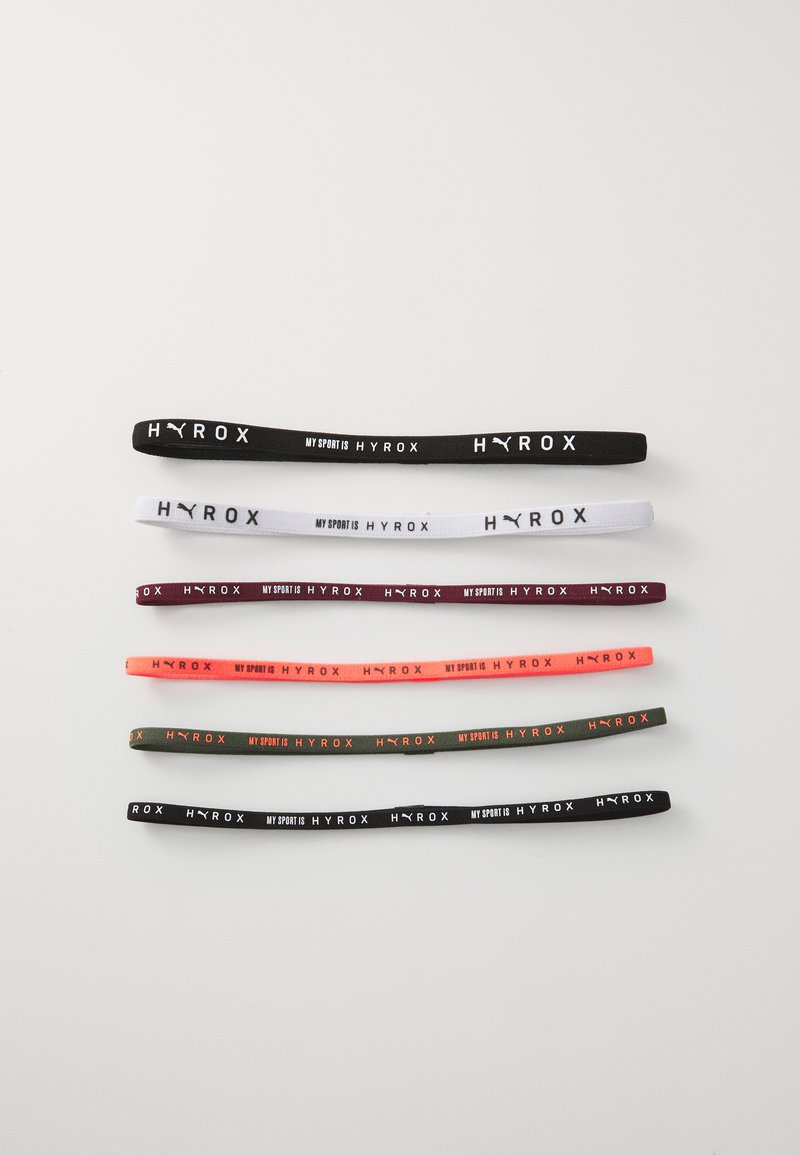Set van acht elastische haarbanden in verschillende kleuren: zwart, wit, donkergroen, kastanjebruin, oranje, roze, en een patroon met de tekst "HYROX".
