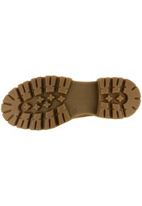 Rubberen laarzenzool, tan kleur, met diepe loopvlakken en groeven voor grip. Heeft hexagonale en kruispatronen voor stabiliteit.