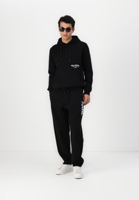 KARL LAGERFELD PANTS - Donji dijelovi trenirke - black