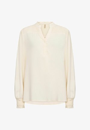 Cremefarvet bluse med samlet halsudskæring, knaplukning og flæsede ærmer. Har lange ærmer og en afslappet pasform. Blødt, let stof.
