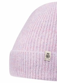 Knit beanie in light purple with ribbed texture and a sewn-on label featuring an emblem, showcasing soft, fuzzy material.