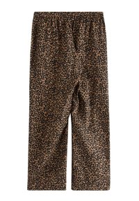 Χαλαρά παντελόνια με λεοπάρ μοτίβο σε καφέ και μαύρο, με ελαστική μέση και απαλό ύφασμα, σχεδιασμένα για άνεση.
