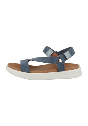 Blue suede sandal with cross straps, adjustable ankle strap, and a white cushioned sole. Features textured insole with perforations.