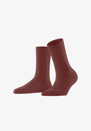 Red textured socks with a ribbed cuff, featuring a diamond pattern and reinforced toe and heel for durability. Cotton blend material.