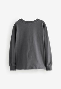 Graues Langarmshirt aus weichem Baumwollmaterial, mit Rundhalsausschnitt und leicht gepufften Ärmeln mit Manschettenverzierungen. Schlichtes und einfaches Design.