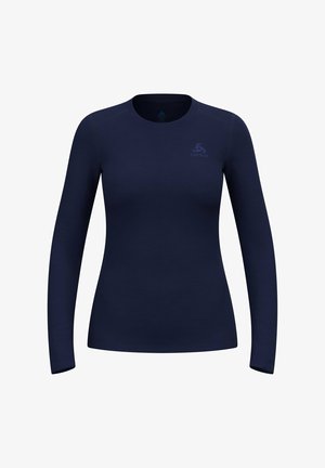 Marineblaues Langarmhemd aus glattem Stoff. Rundhalsausschnitt mit minimaler Markenkennzeichnung oben links. Figurbetonte Silhouette und nahtloses Design.