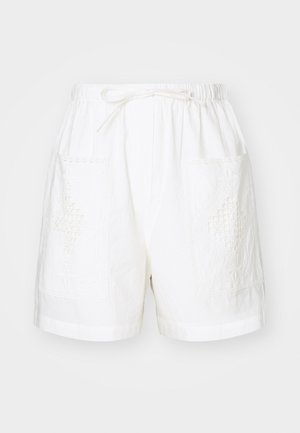 Calções de algodão brancos com uma cintura elástica, cordão de ajuste e dois bolsos frontais apresentando intrincados padrões de bordado.