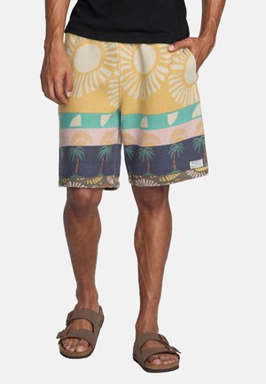 Kleurige zwembroek met patronen van de zon en palmbomen. Gemaakt van een zachte, gestructureerde stof. Geel, teal, roze en marineblauwe kleuren.