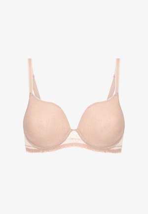 Reggiseno in pizzo di un rosa chiaro con coppe lisce e imbottite, spalline regolabili e un motivo floreale. Il pizzo lungo i bordi accentua i dettagli.