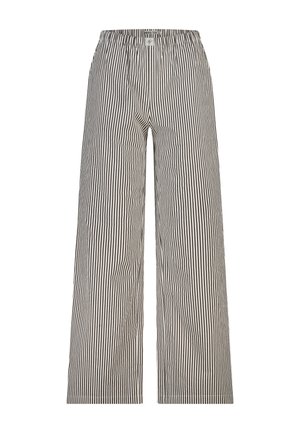 Loszittende broek met zwart-witte verticale strepen en elastische tailleband.