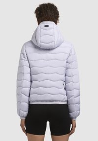Light purple puffer jacket with a hood, wave-like quilted texture, elastic cuffs, and a snug fit at the waist. Back view shown.
