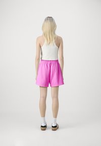 GAP Pantaloni sportivi - standout pink