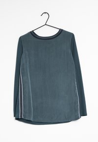 Langärmliges Oberteil aus türkisfarbenem Stoff, mit einem runden, marineblauen Kragen und weißen seitlichen Streifen, gerader Schnitt und weicher Textur.