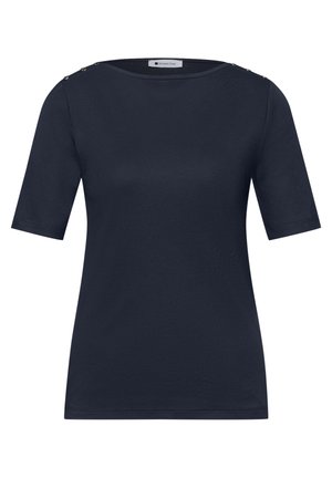 Camisa azul marino de manga corta con escote redondo y tres botones metálicos en cada hombro.