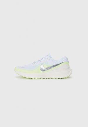 White running shoe with light green accents, textured mesh upper, reflective silver Nike logo, and a cushioned sole.
