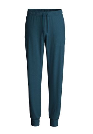 Turquoise joggingbroek met een elastische tailleband en koord, voorzien van geribbelde boorden en twee zijzakken, gemaakt van zachte stof.