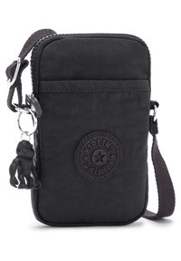 Borsa a tracolla nera in tessuto con chiusura zip, tasca frontale, patch rotondo con logo e un portachiavi a forma di scimmia. Materiale testurizzato e tracolla regolabile.