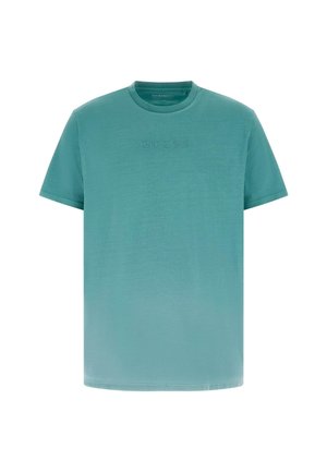 Meriinovärvi lühikeste varrukatega ümarseljaga T-särk, rinnal õrnalt reljeefse "GUESS" logoga, lihtsa disainiga, tavapärase sobivusega.