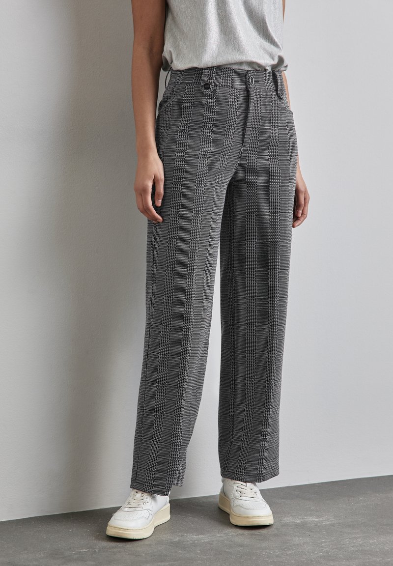 Harmaa ja musta ruutukuosi leveälahkeiset korkeavyötäröiset housut, joissa on nappi- ja hakasuljenta, viistot taskut ja sileä pinta.