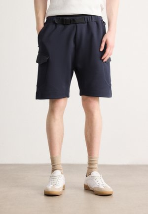 HARIQ GLAMPING - Tracksuit bottoms - dark blue