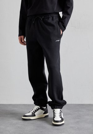 PANTALONE - Jogginghose - black