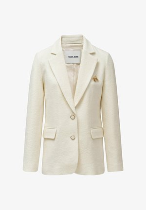 Veste crème texturée avec un col cranté, deux poches avant et une unique broche abeille dorée en accent. Elle comporte deux boutons métalliques.