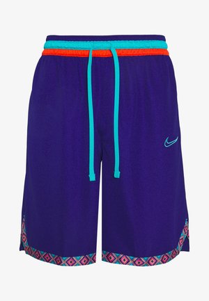 Shorts de sport violets avec un cordon turquoise et orange, présentant un ourlet à motifs rose, bleu et blanc. Logo Nike en turquoise.