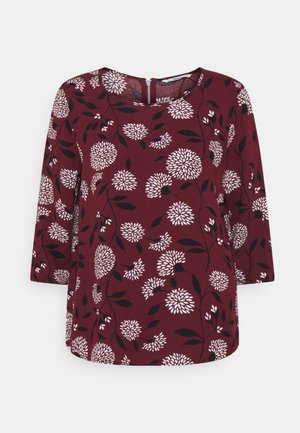 Bordowa bluzka z białymi kwiatowymi wzorami i czarnymi liśćmi, z rękawami do łokcia i okrągłym dekoltem z zamkiem z tyłu.