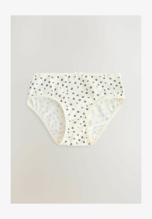 Weiße Unterwäsche mit kleinen schwarzen Blumenmustern, ausgestattet mit einem bequemen elastischen Bund und einer dekorativen Schleife an der Vorderseite.