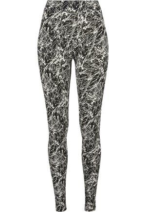 Schwarze Leggings mit einem weißen abstrakten Muster, aus dehnbarem Material, im schlanken Schnitt und mit einem elastischen Bund für zusätzlichen Komfort.