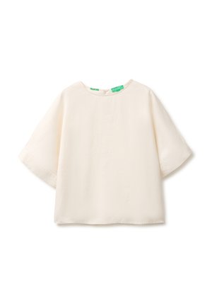 Blusa de color crema suave con mangas cortas, escote redondo y un corte suelto y cuadrado.