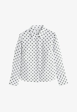 Valge nööbitav särk mustade täppidega, klassikalise kraega, pikad varrukad ja sirge äärega. Sile kangas krõbeda viimistlusega.