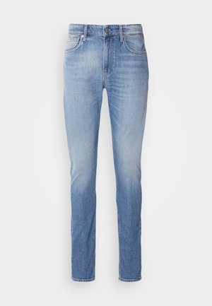 Light blue denim jeans with a straight leg cut, featuring a mid-rise waist, five pockets, and subtle fading across the fabric.