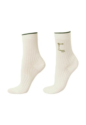 Kremfarvede ribstrikkede crew-sokker med mørkegrøn kant, med en lille broderet logo og tekst på ydersiden af den ene sok.