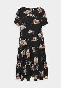 Mustassa kukallisessa mekossa on lyhyet hihat, kokoontaitettu vyötärö, kerrosrakenteinen muotoilu sekä pinkkejä ja keltaisia kukkakuoseja kauttaaltaan.