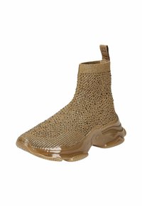 Botines de punto marrones con parte superior texturizada y suela de goma brillante y esculpida. Presentan un tirador para facilitar su colocación.