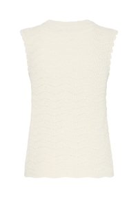 Haut sans manches en tricot de couleur crème avec des bords ondulés et un motif texturé ondulé sur tout le tissu.