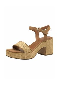 Sandalo in faux suede marrone con una ampia trama intrecciata, una piattaforma spessa intrecciata e un tacco blocco rettangolare. Cinturino alla caviglia regolabile con fibbia in metallo.