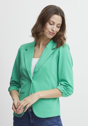 Grön, lätt blazer med en strukturerad design, slagkrage och trekvartsärmar, med en enkel knapp och framficka.