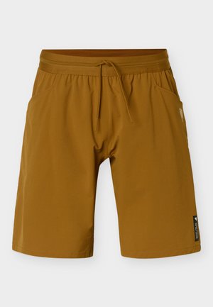 Rudi vyriški laisvalaikio šortai su elastinga juosmens juosta, priekyje suvarstomu raišteliu, šoninėmis kišenėmis ir mažu juodu etikete apatiniame dešiniajame kojos gale.